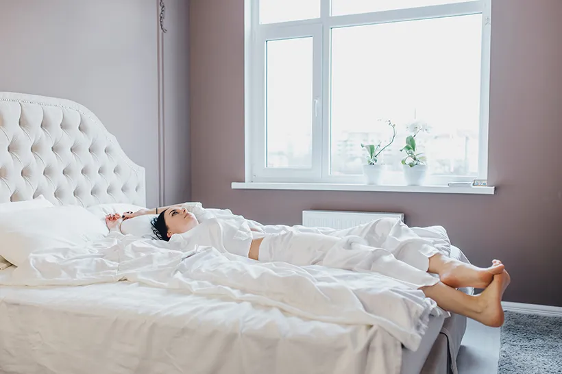 Woman sleeping peacefully in a clean bed, bed bug treatment in Salt Lake City, UT