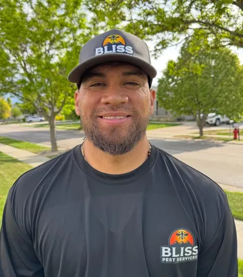 Bliss Pest Services technician in a branded cap and shirt, Salt Lake City pest control